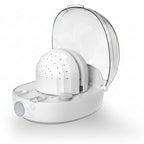 White hat cleaning machine with a bottle of hat cleaner on a white background