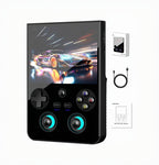 Black handheld gaming console with gamepad, power adapter, and user manual on a reflective surface.